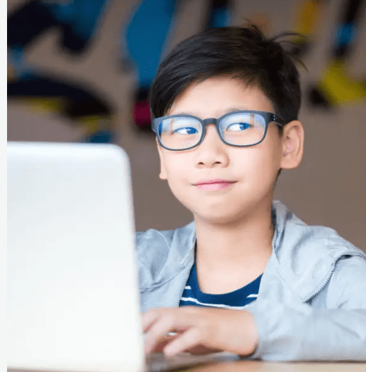 asian boy with glasses myopia on laptop