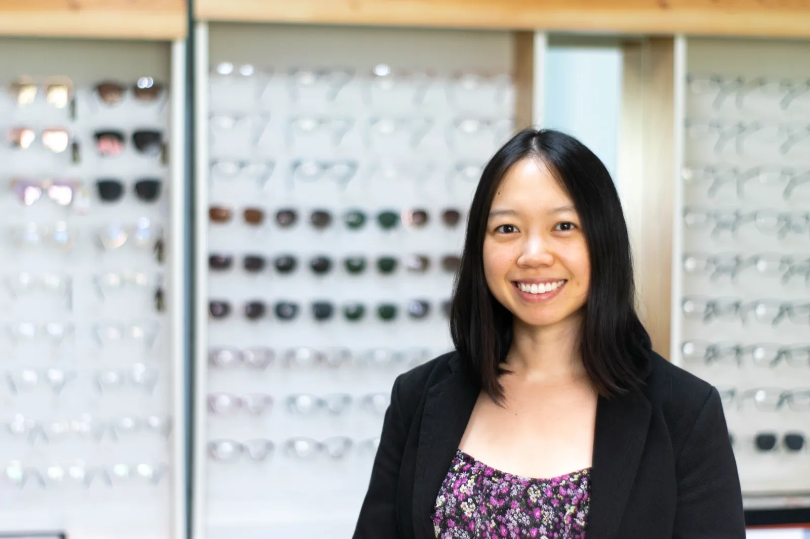 Dr Carina Trinh fitting a patient with new glasses