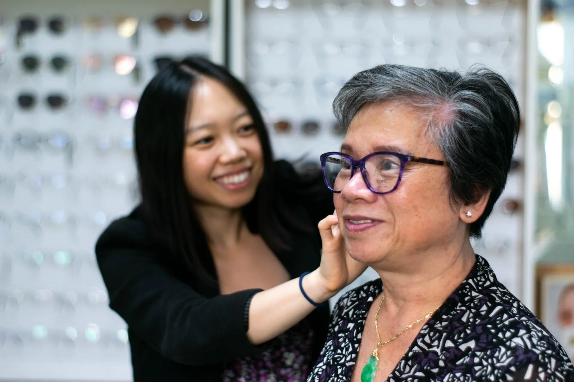 Dr Carina Trinh fitting glasses on a patient at Carina Eye Care
