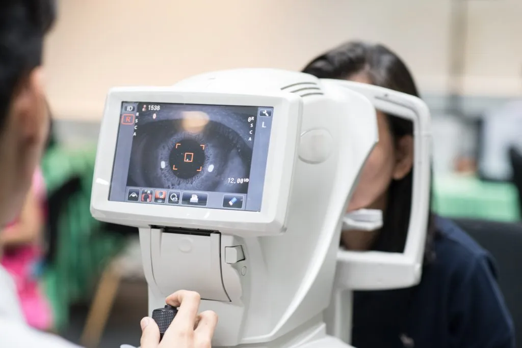 Optometrist performing a general eye examination